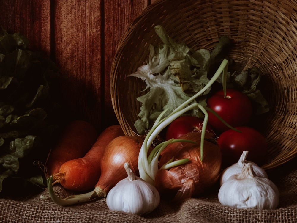 red and white onion on brown woven basket