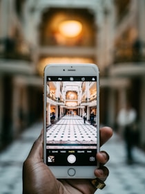 person holding silver iphone 6