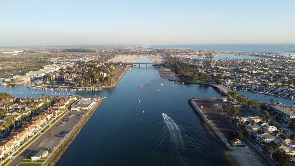 aerial view of city buildings near body of water during daytime