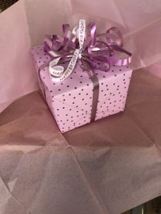 Bright and cheerful birthday presents wrapped in colorful paper with ribbons and confetti around