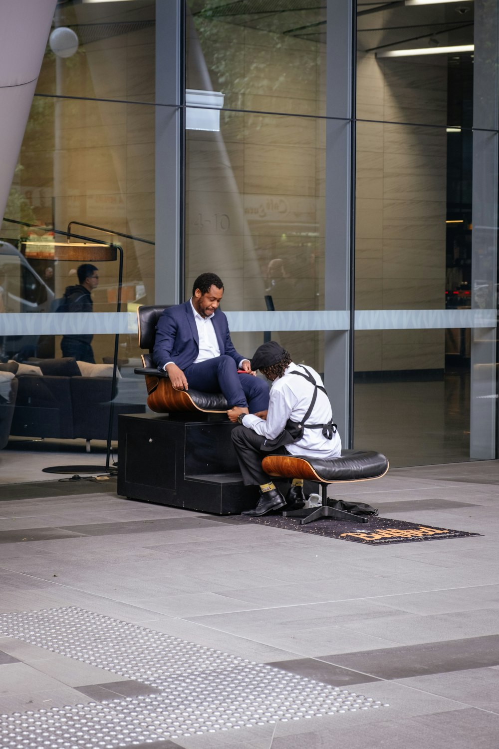 man in white dress shirt sitting on black office rolling chair