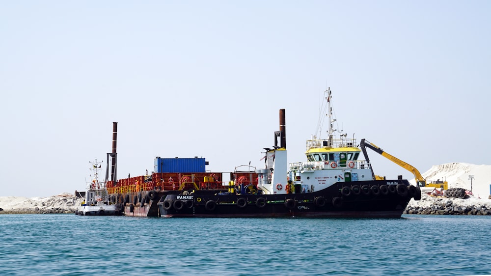 black and white ship on sea during daytime