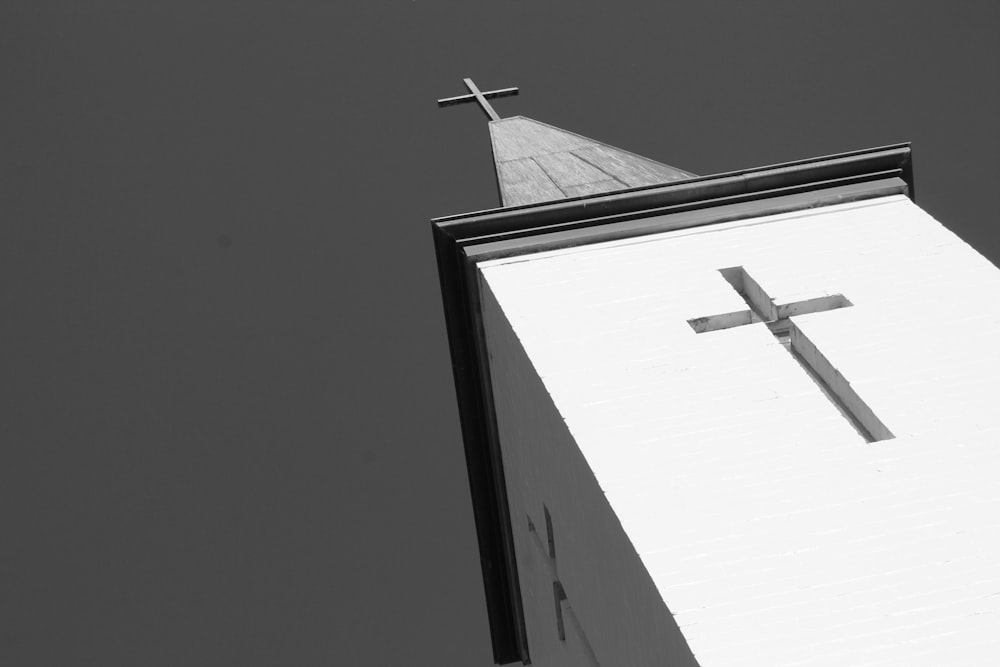 white cross on top of building