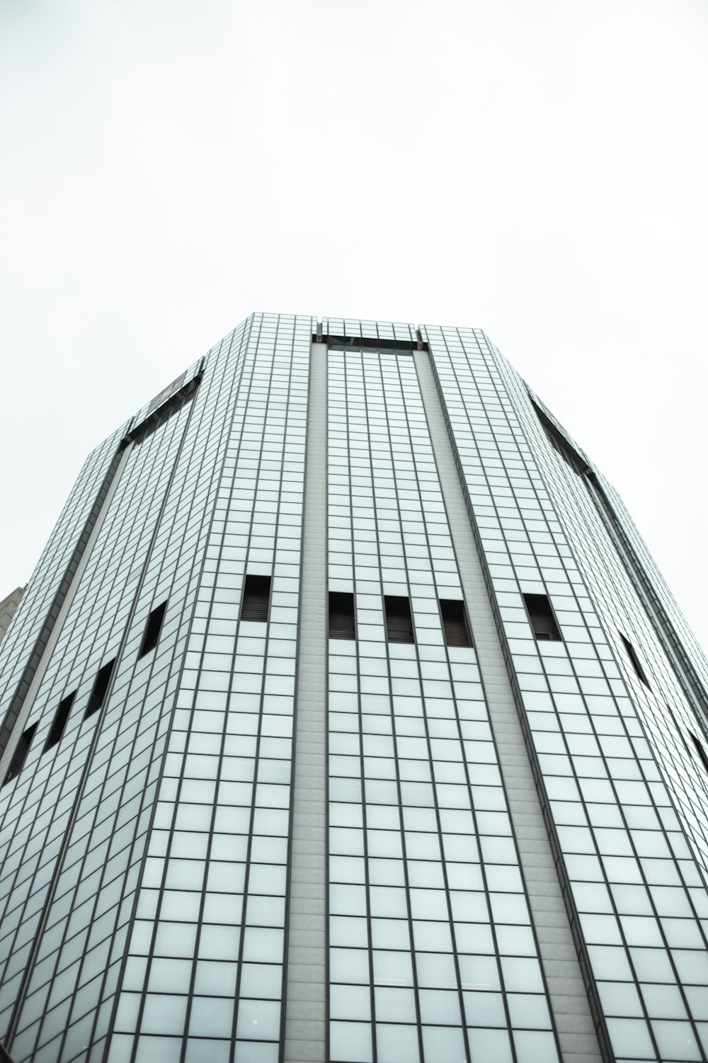 low angle photography of gray concrete building