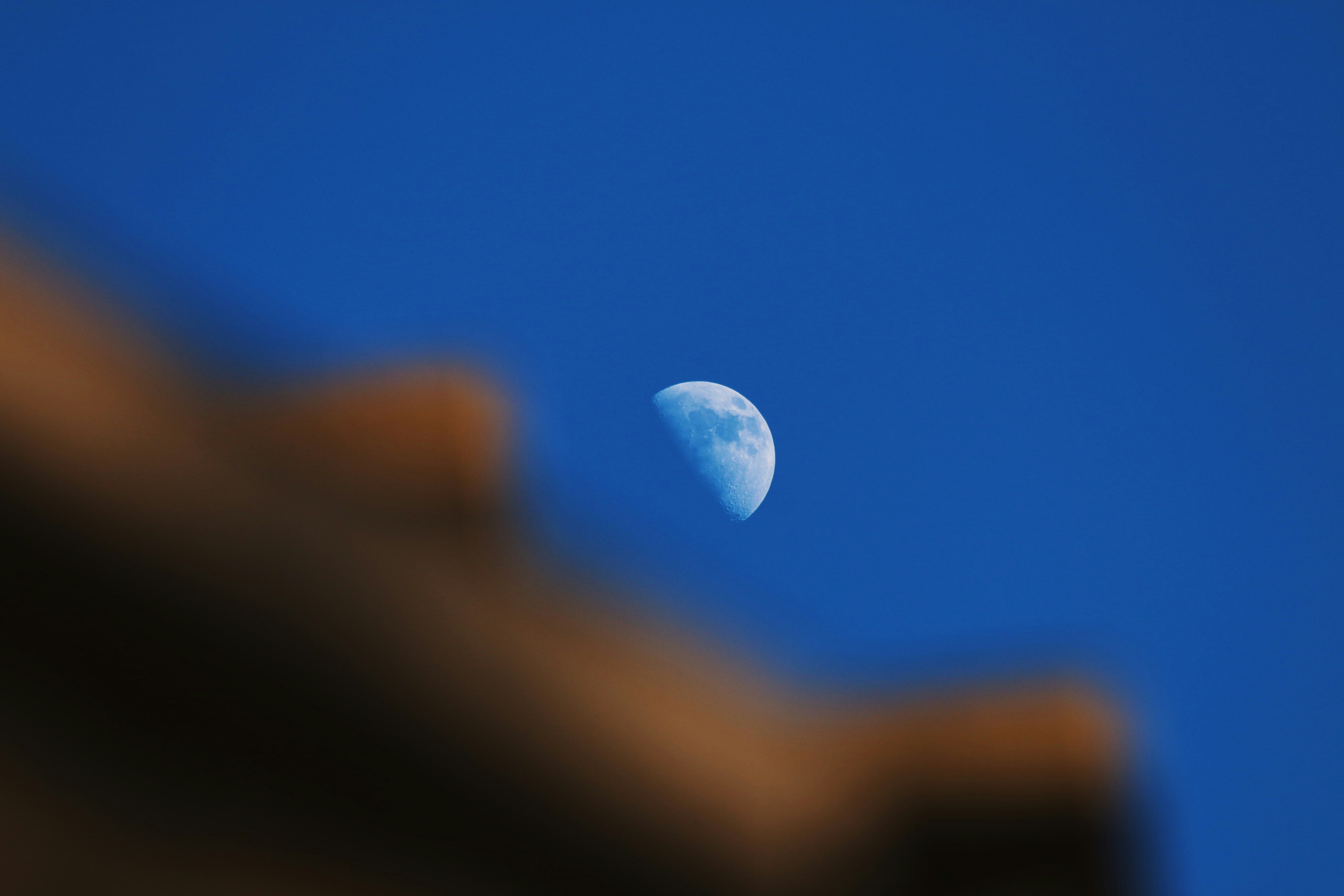 white moon in blue sky, Moonrise over brick
