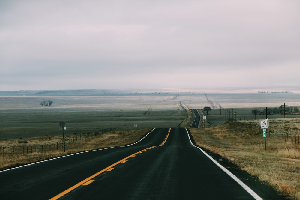 gray asphalt road under gray sky