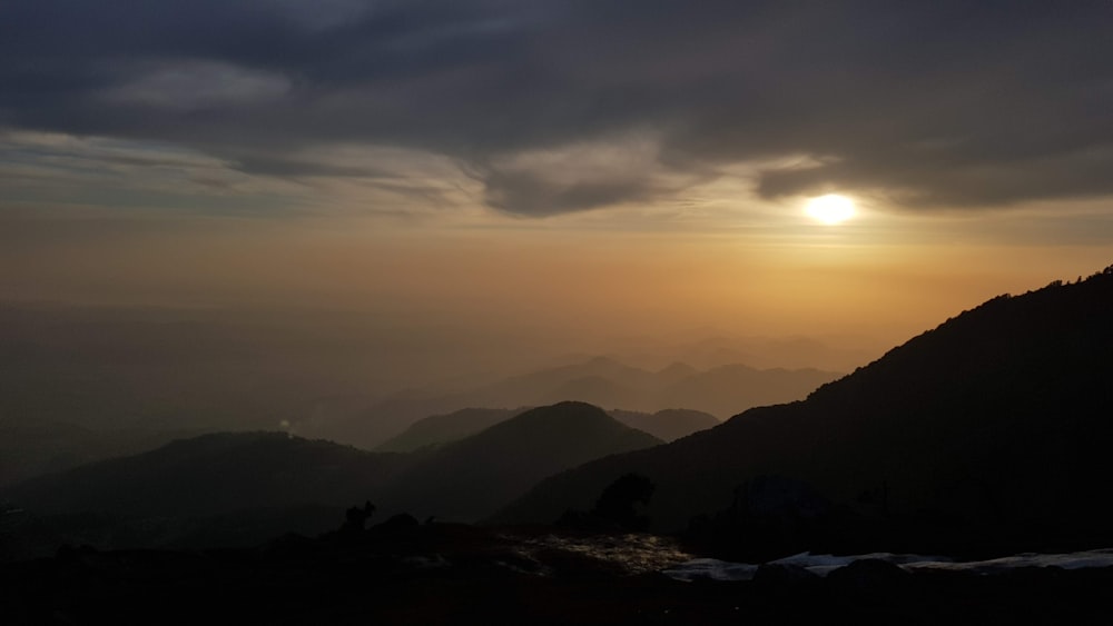 silhouette of mountains during sunset