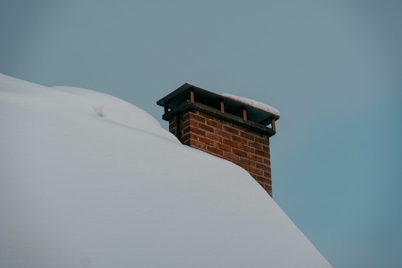 brown brick building under blue sky during daytime