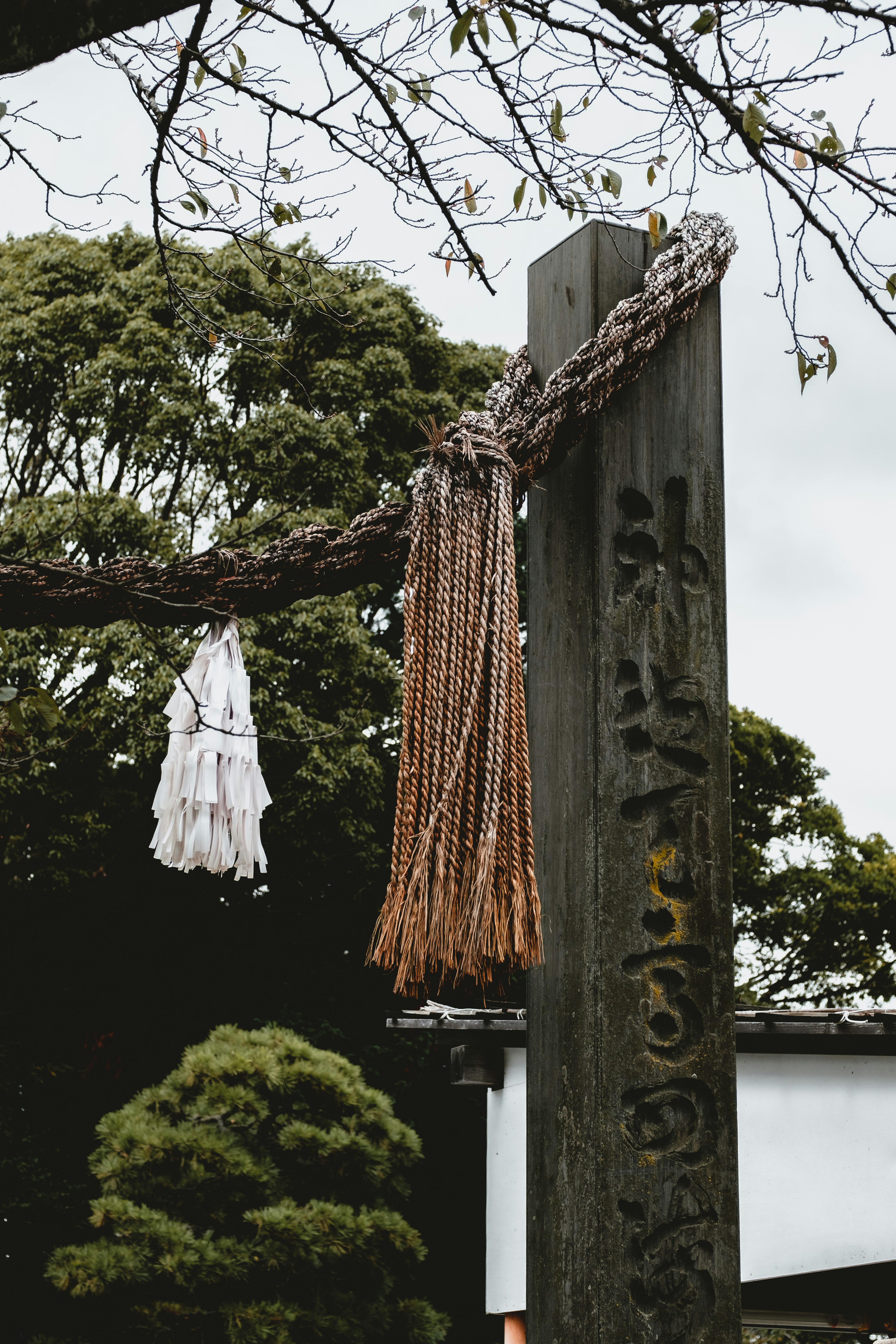 brown wooden cross with white textile