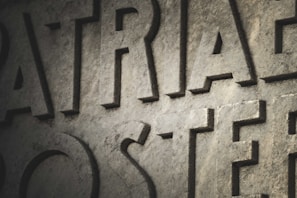 Close-up of freshly sandblasted granite letters on a tombstone, highlighting crisp edges and restored clarity