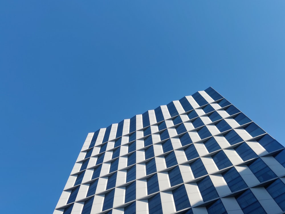 white and black concrete building under blue sky during daytime