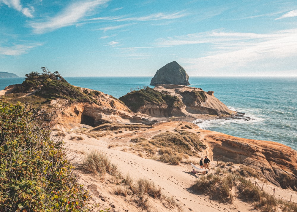 brown rock formation on sea shore during daytime