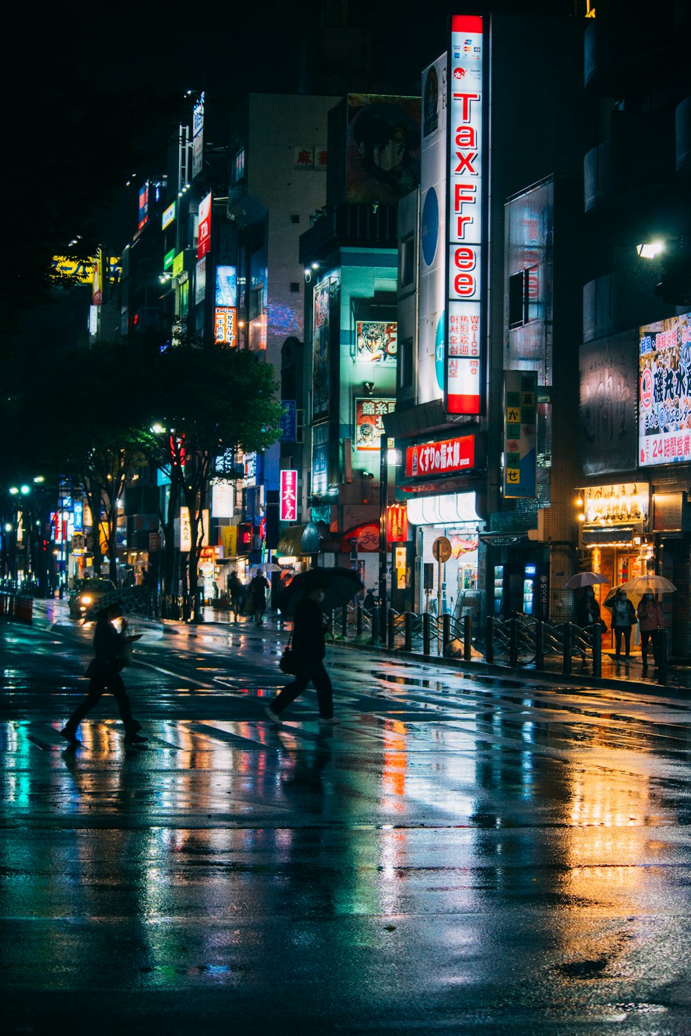 people walking on street during night time