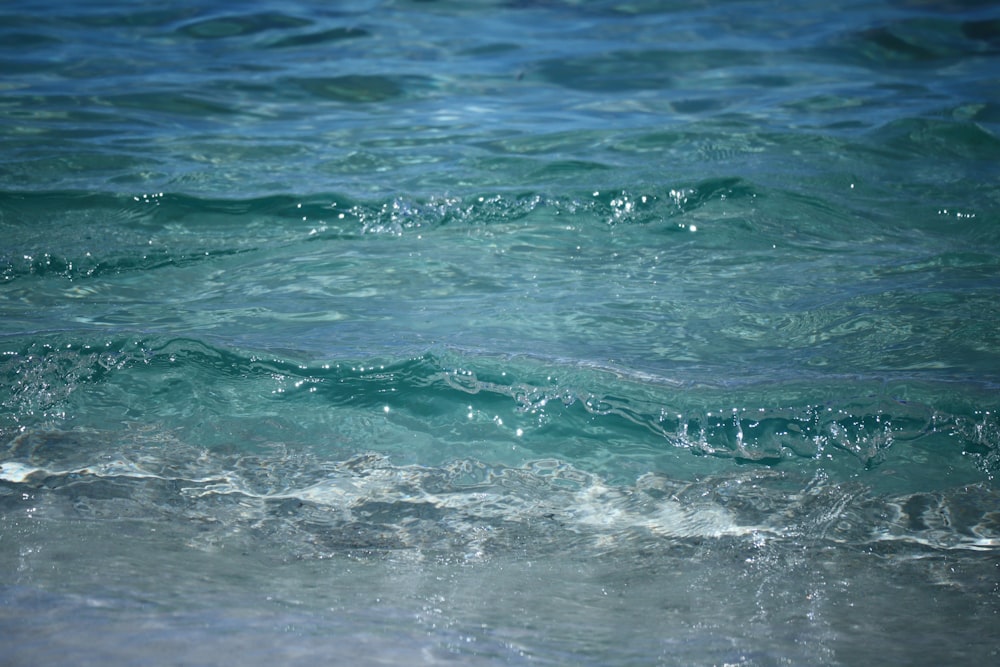 water waves on blue sea during daytime