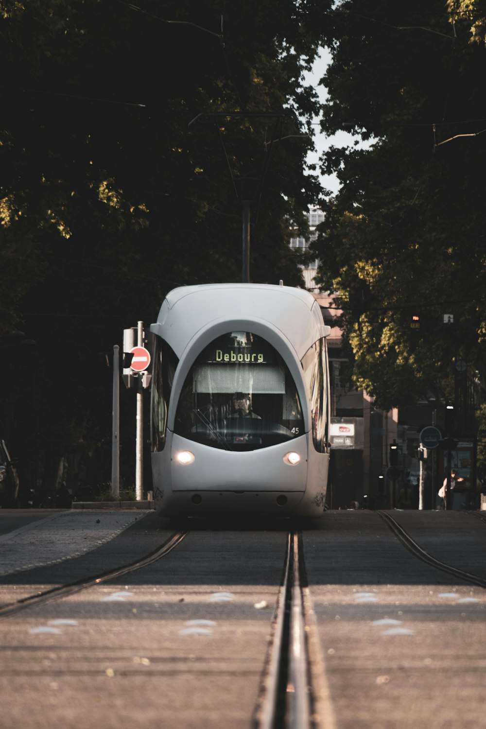 white and black train on the street