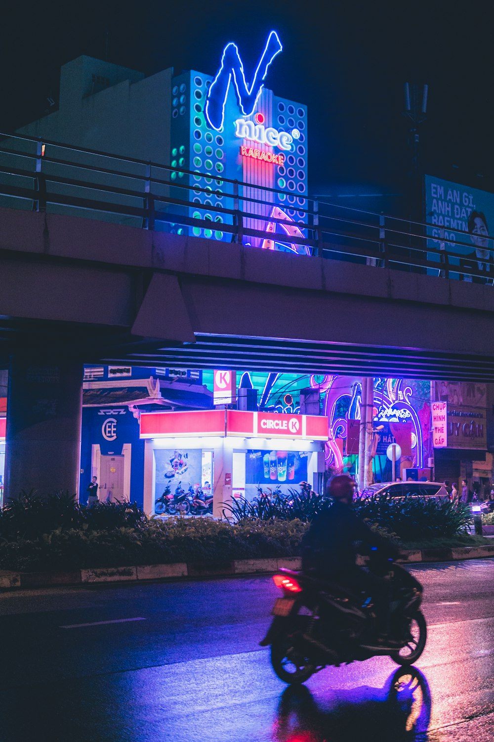 black car parked in front of store during night time