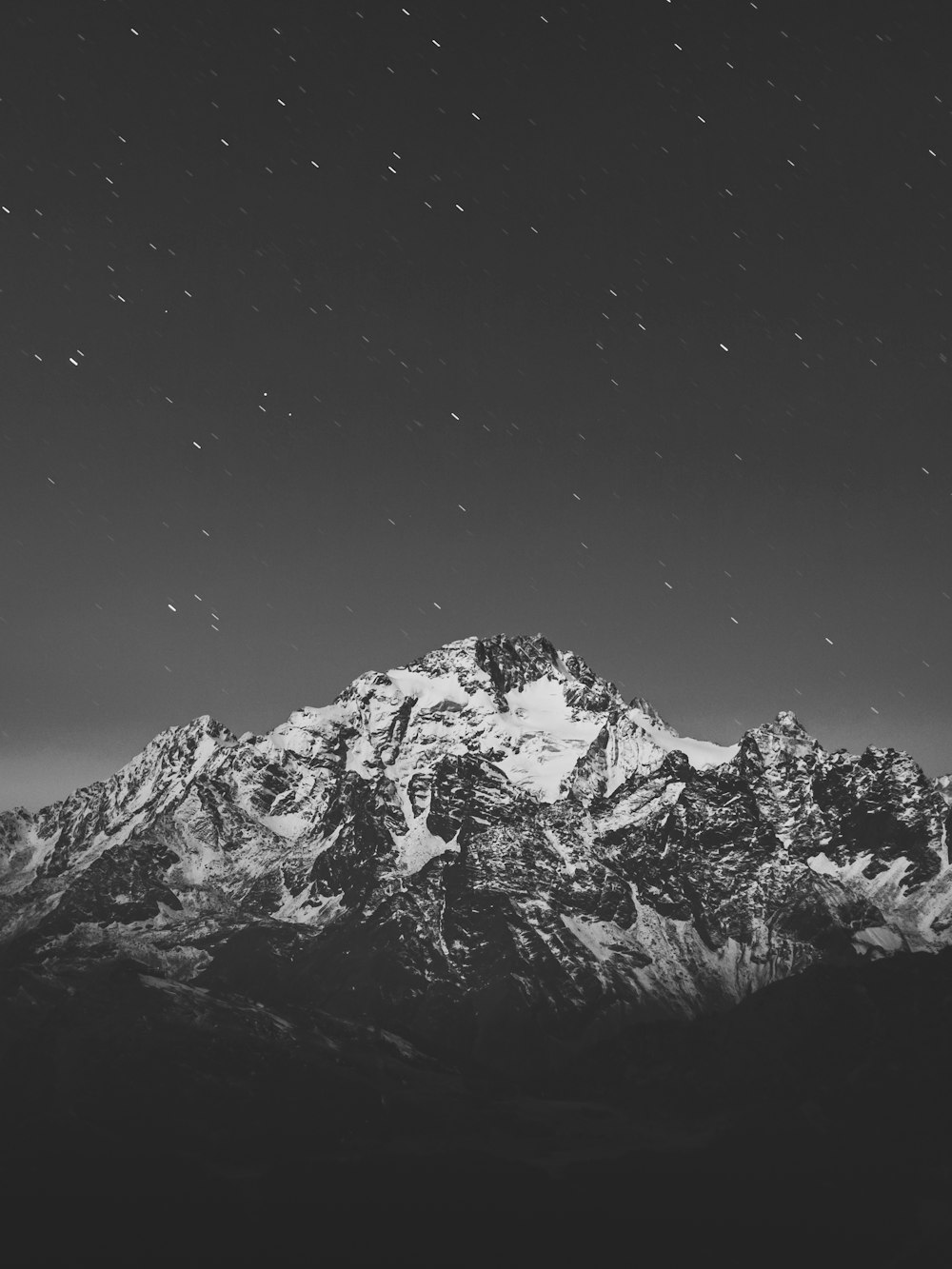 grayscale photo of snow covered mountain