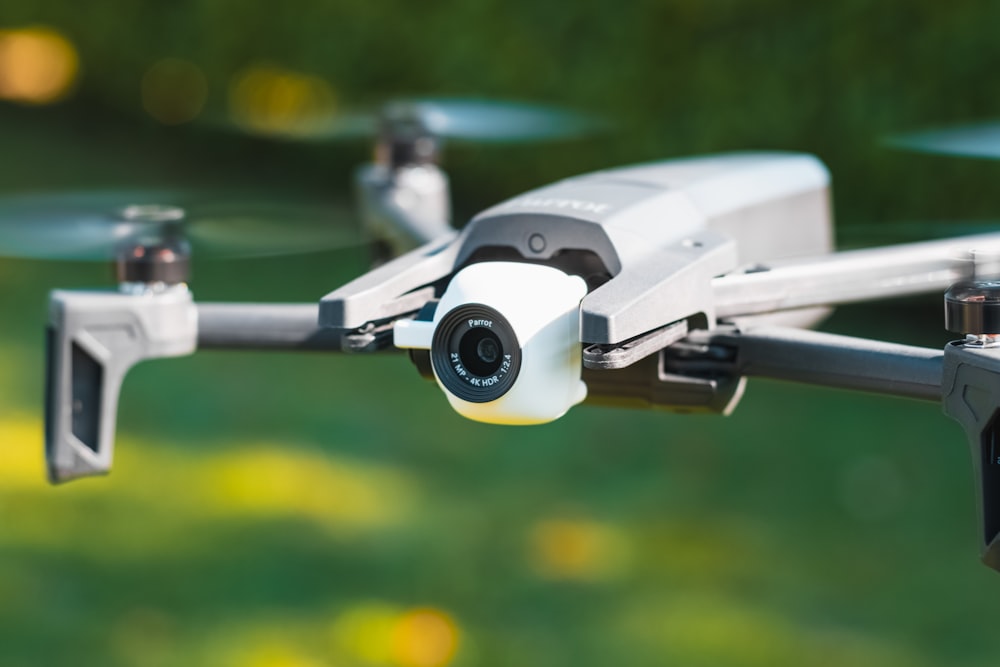 white and black drone in close up photography during daytime