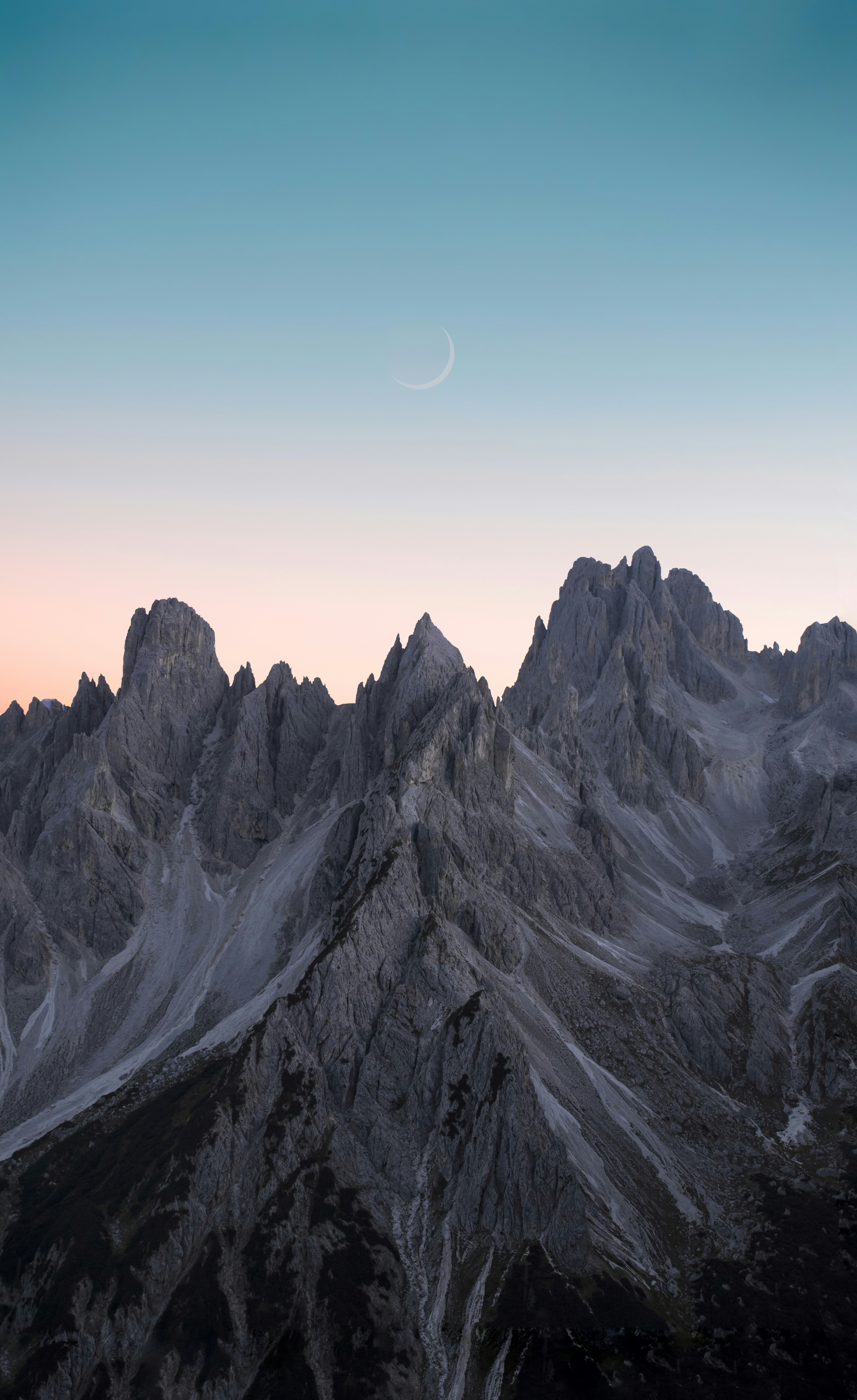 black and white mountains under blue sky