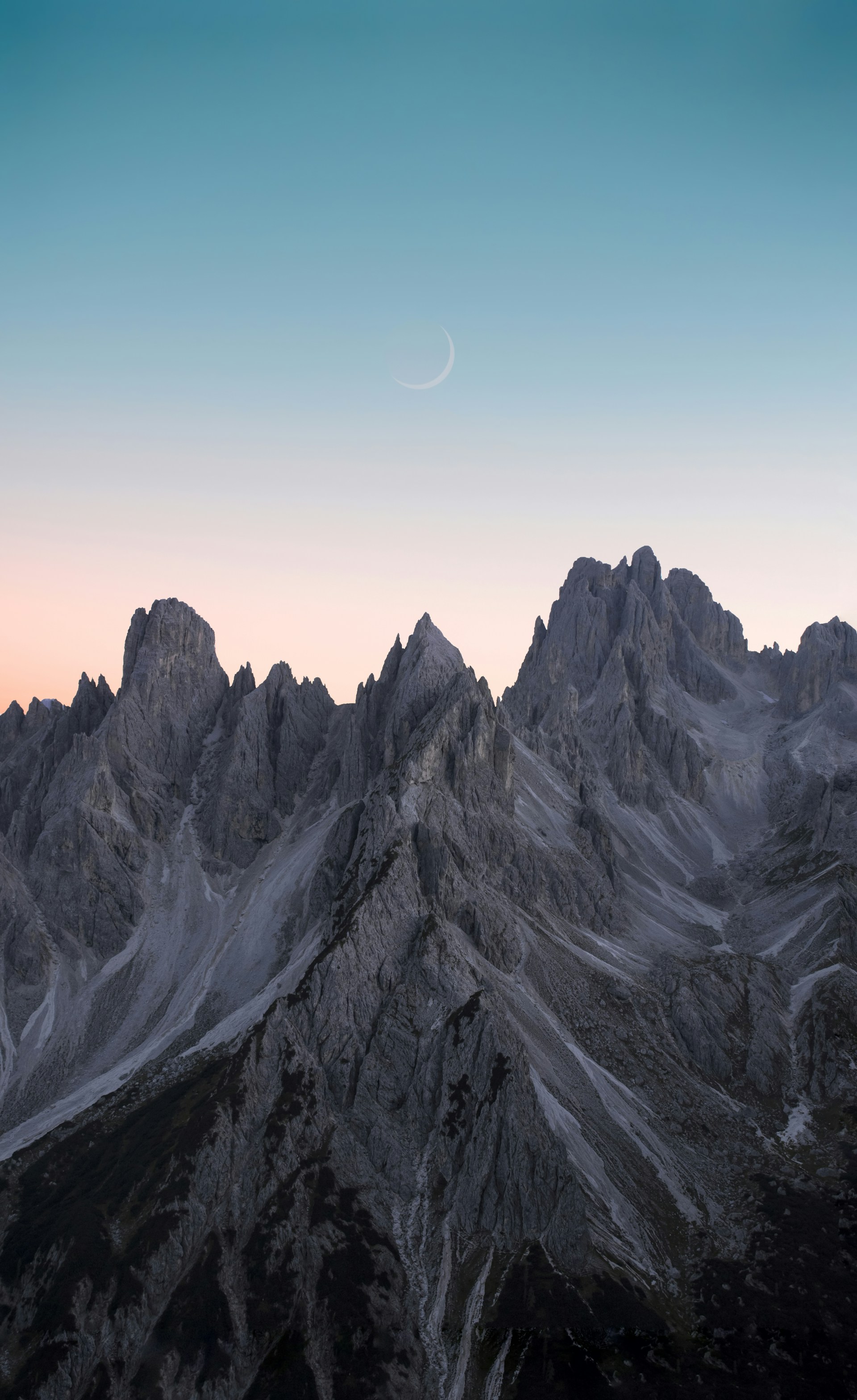 black and white mountains under blue sky