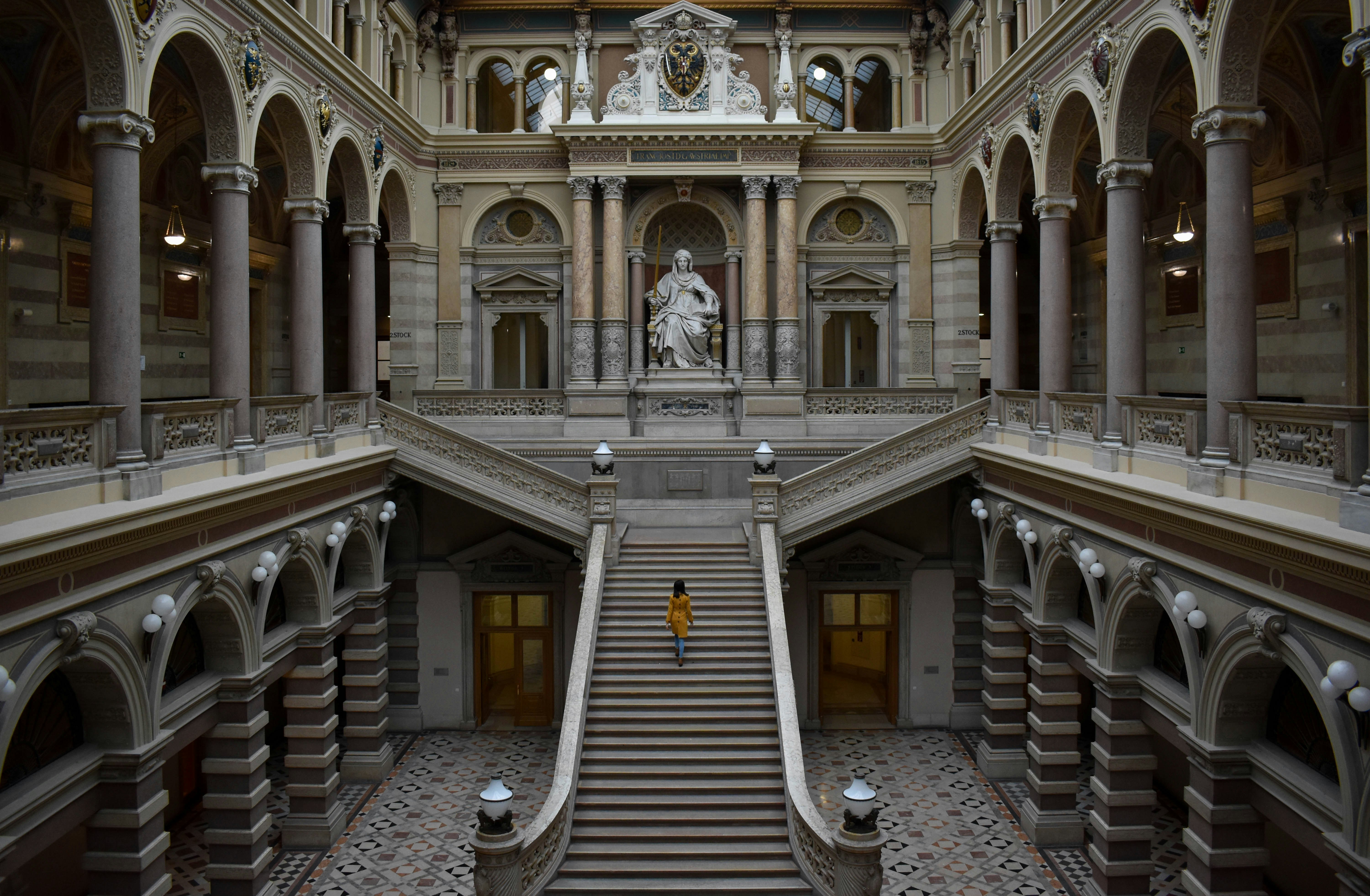 gray concrete staircase in front of white concrete building österreich teams background