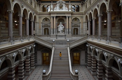 gray concrete staircase in front of white concrete building österreich teams background