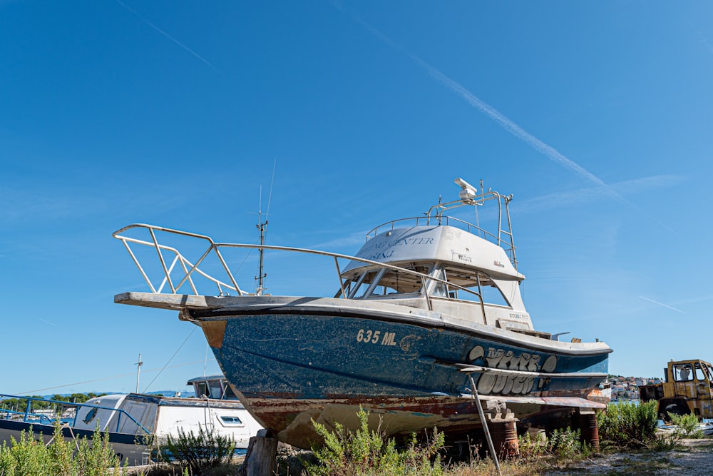 white and brown boat on sea dock during daytime