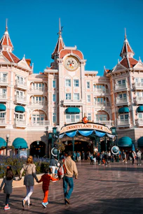 people walking near white concrete building during daytime