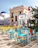A vibrant public seating area with colorful, culturally inspired furniture pieces.