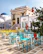 A vibrant public seating area with colorful, culturally inspired furniture pieces.