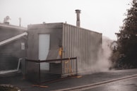 Open-sided container used as an on-site control room, with clear signage and equipment visible.