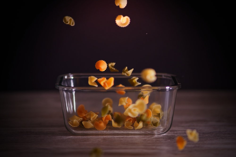yellow fruits in clear glass bowl