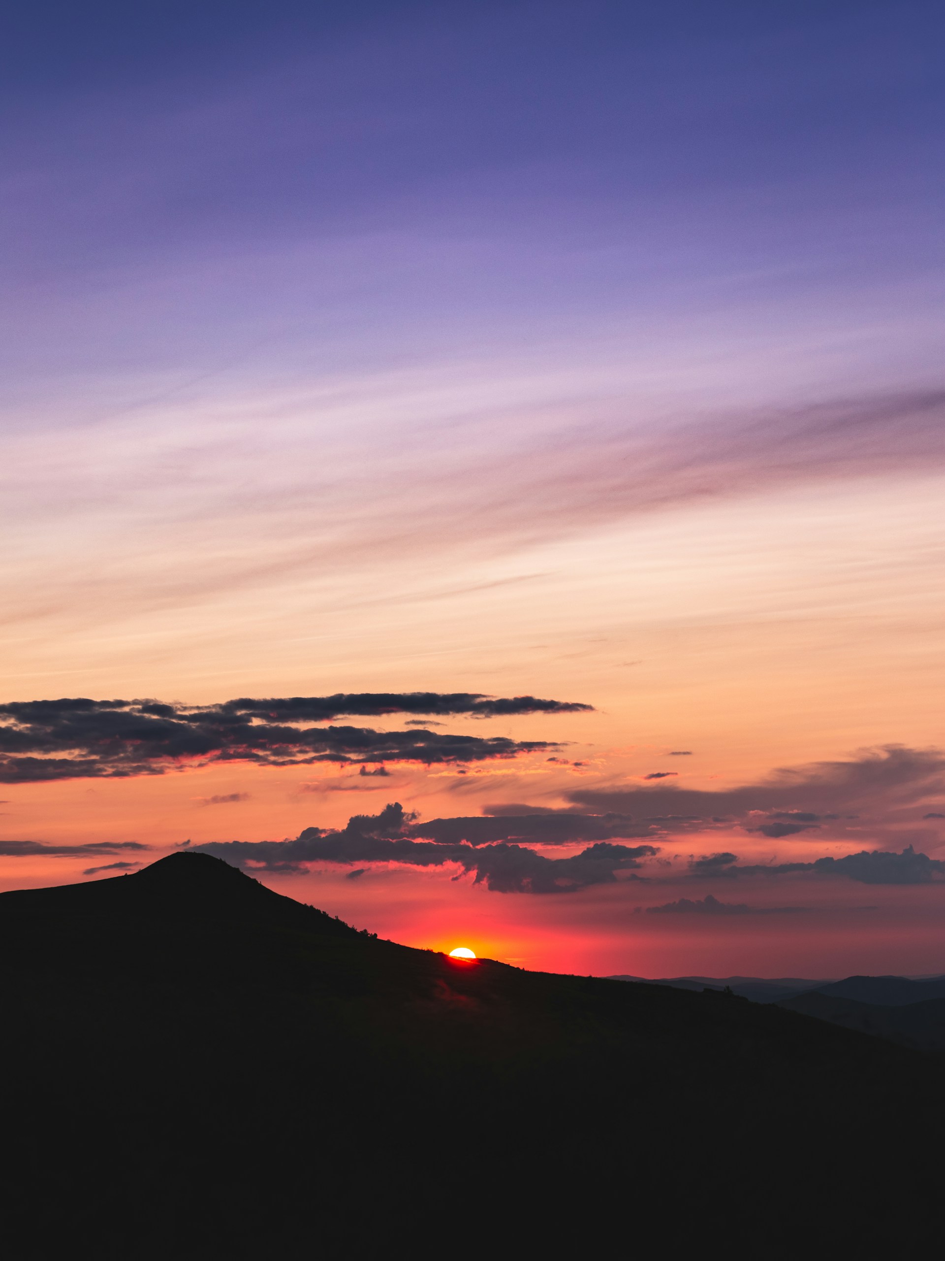 silhouette of mountain during sunset