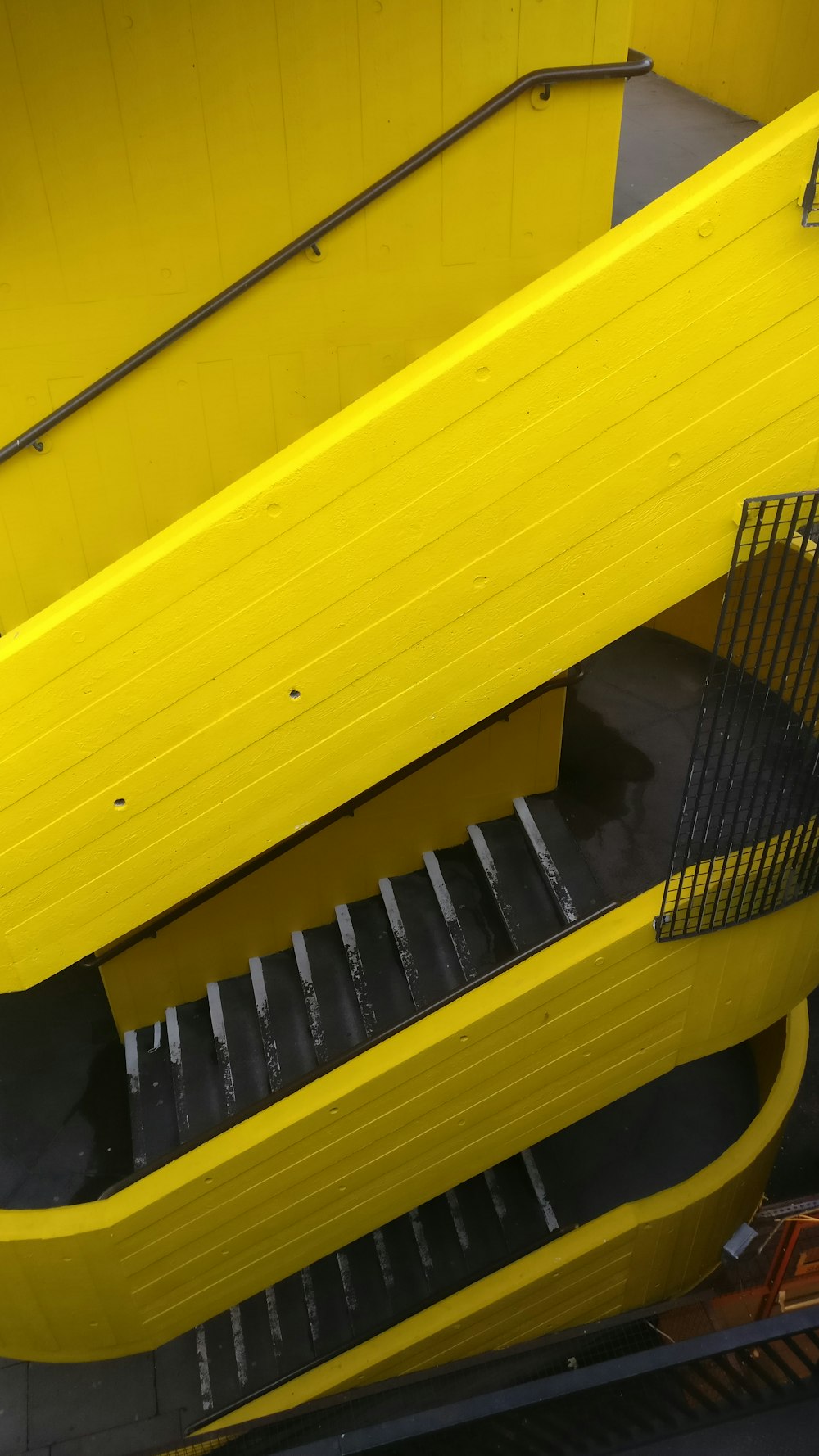 black plastic hair comb on yellow table