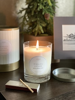 white candle on black wooden table