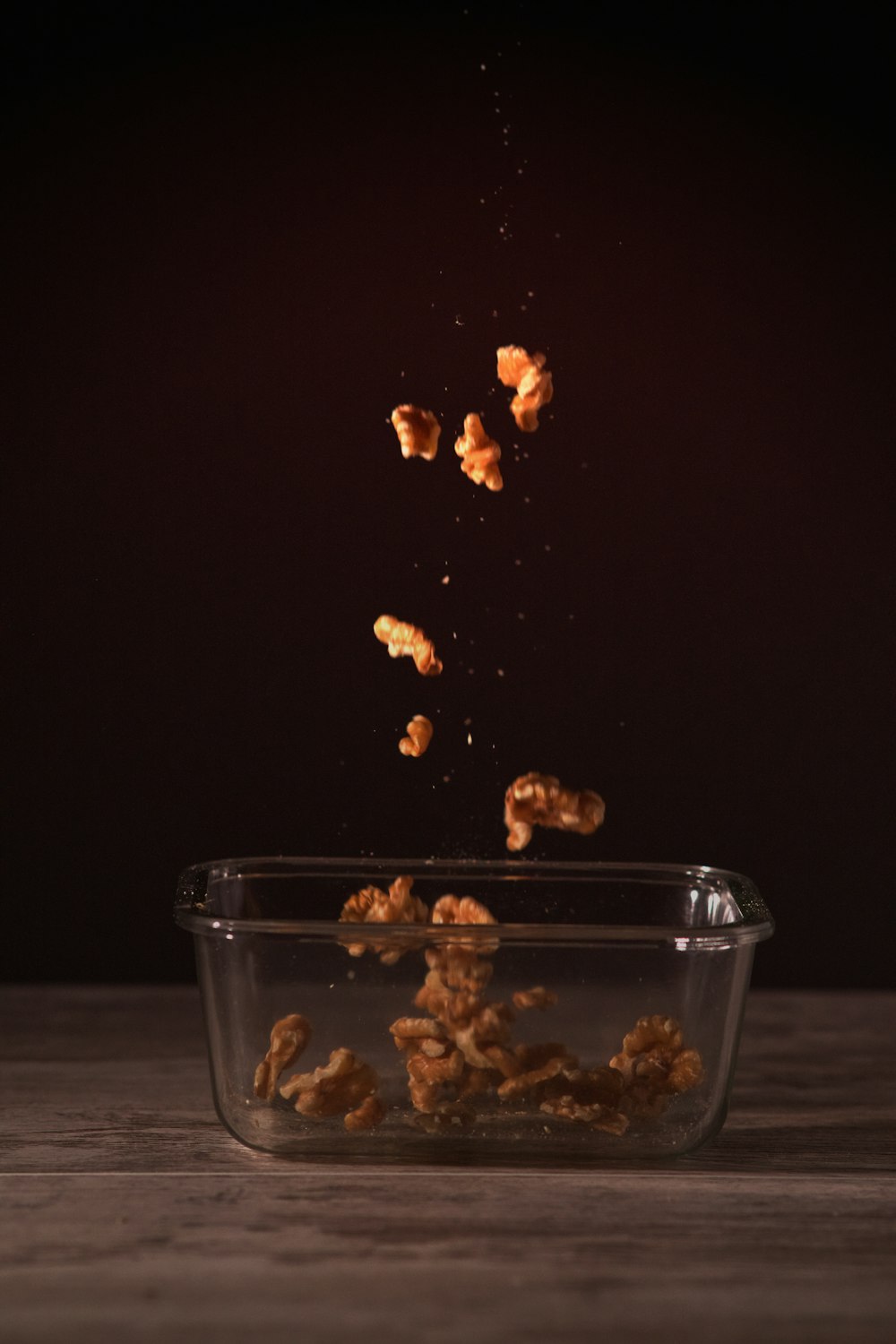 brown food in clear glass bowl