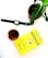 A pot with a green plant is placed on a white surface alongside a smartwatch, a glass of tea, and a yellow book titled 'Hooked' by Nir Eyal.