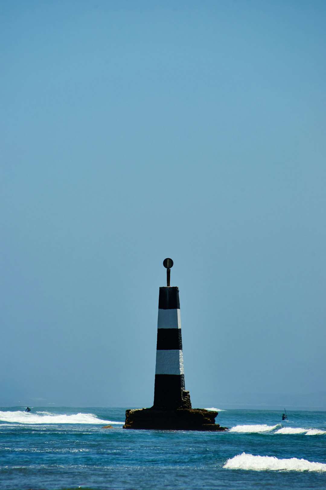 black and white tower under blue sky