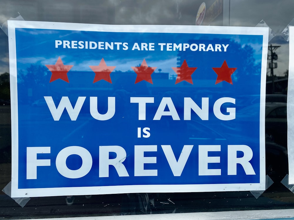 a blue sign that says wu tang is forever
