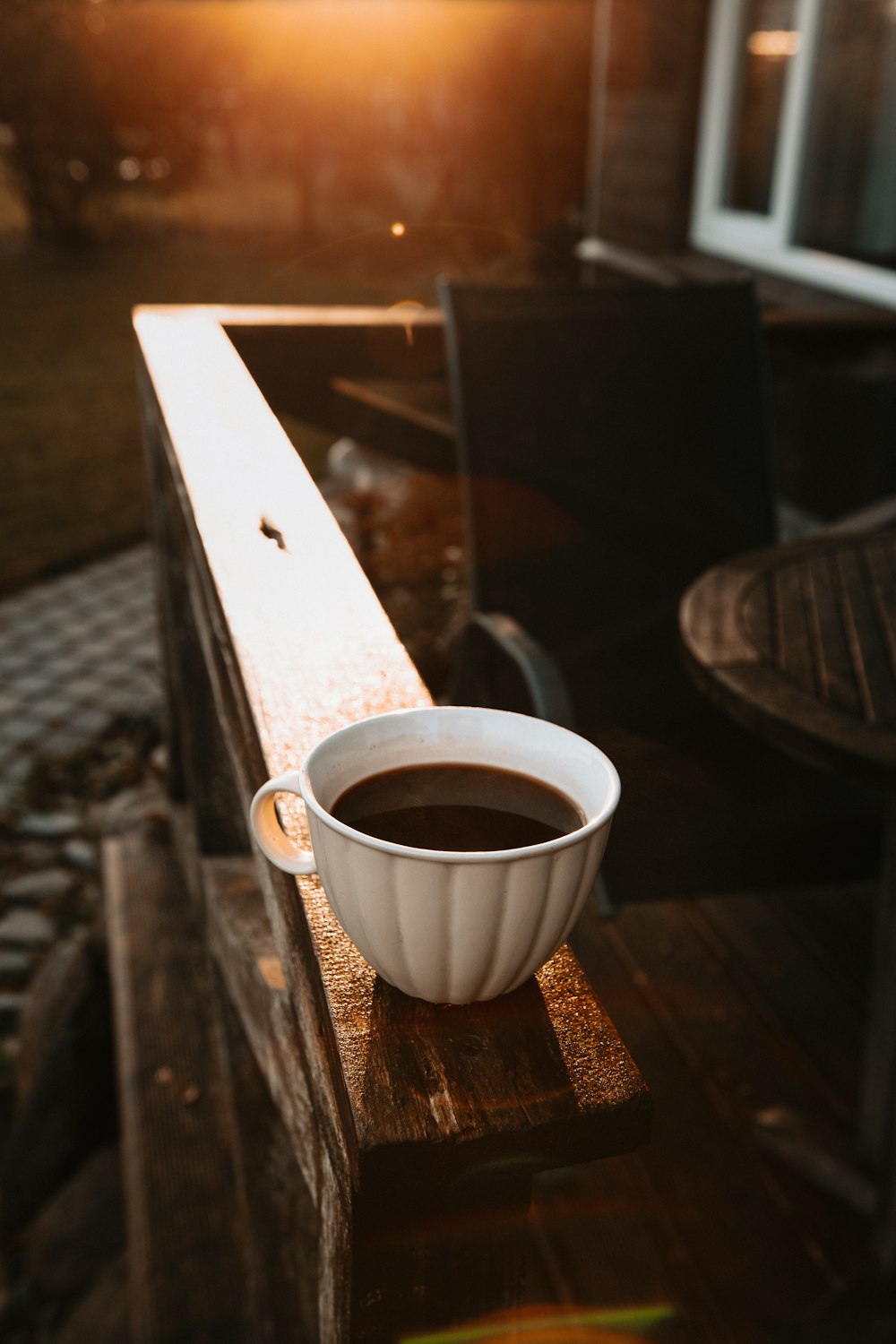 white ceramic mug on brown wooden table