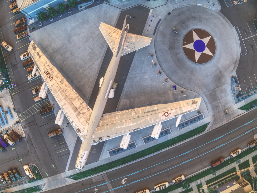 aerial view of white and brown building, The RB-52 on display outside the Wings over the Rockies Museum