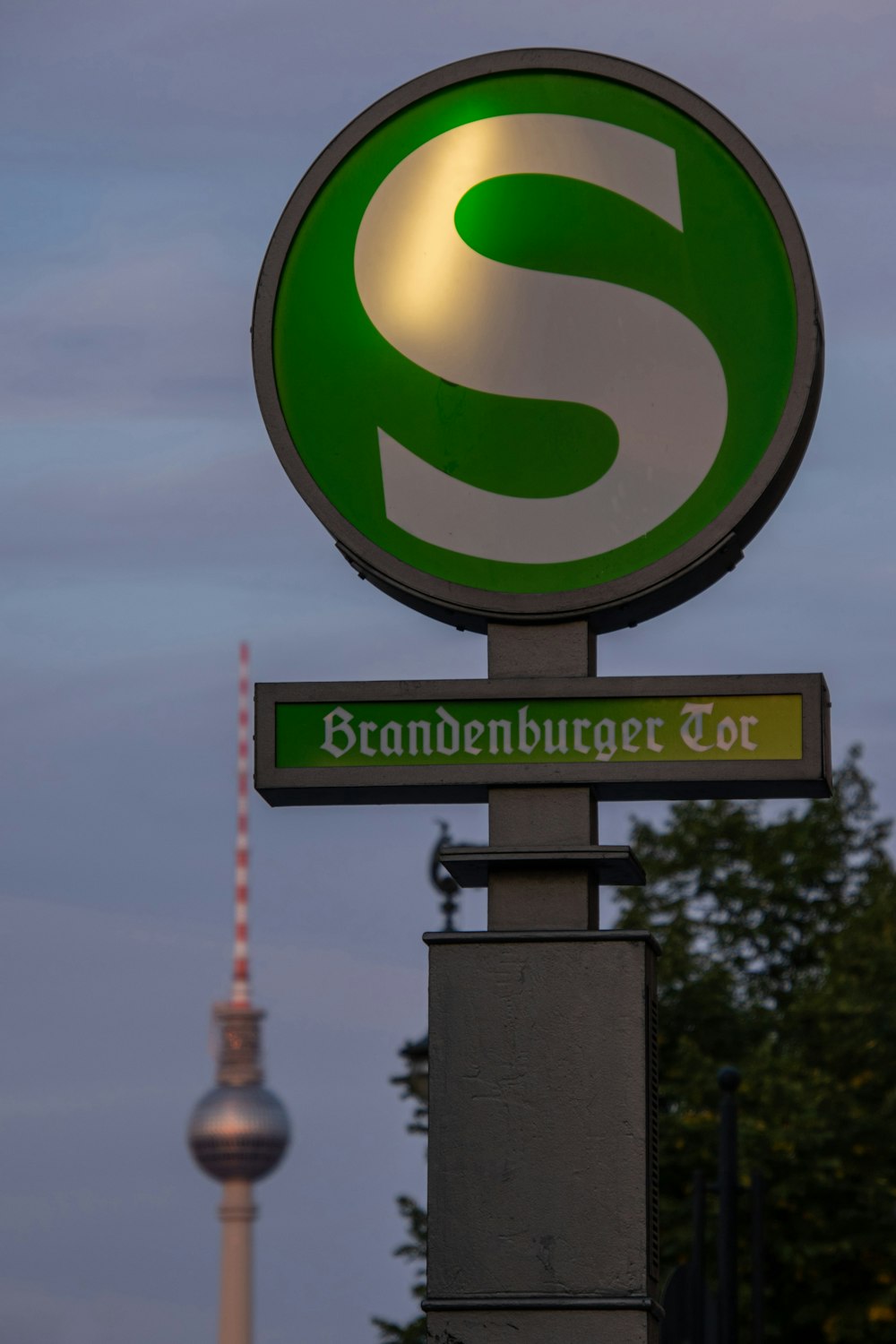 green and white round sign