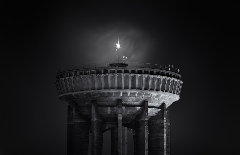 grayscale photo of a building with light