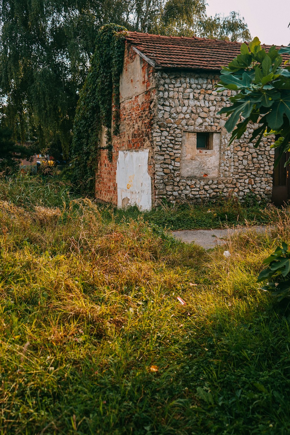 brown brick house on green grass field