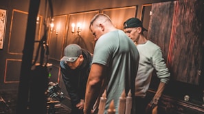 Expert team member testing a TV after panel replacement in a bright service room
