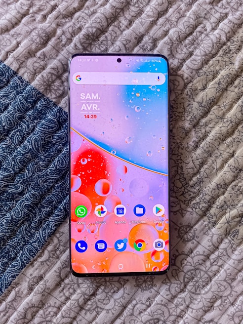 A smartphone displaying a deal alert notification with colorful icons around it