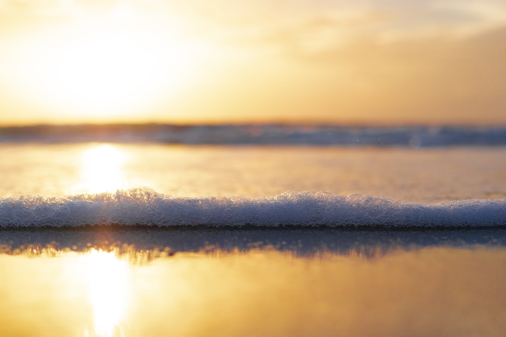 body of water during sunset