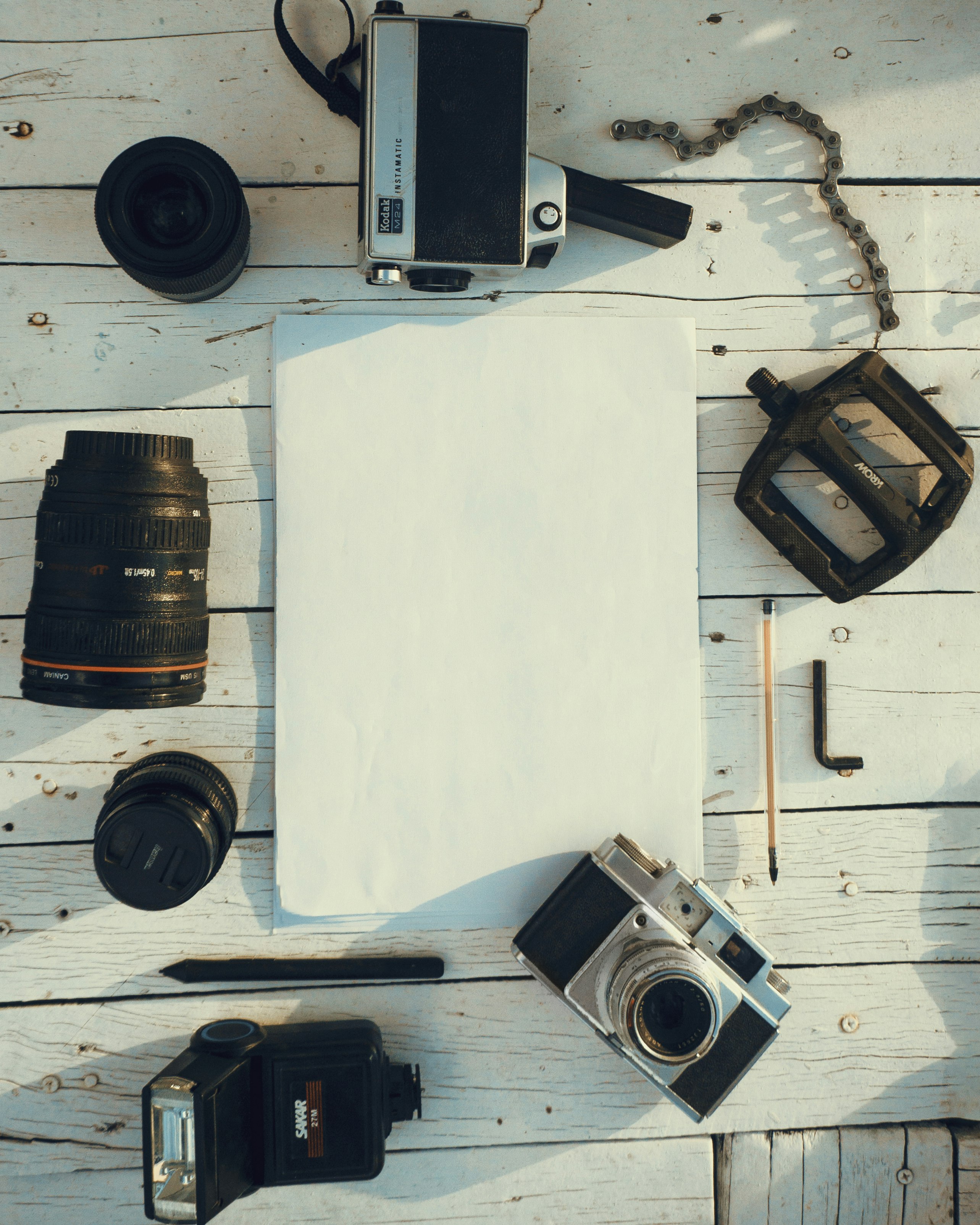 black and silver camera on white table