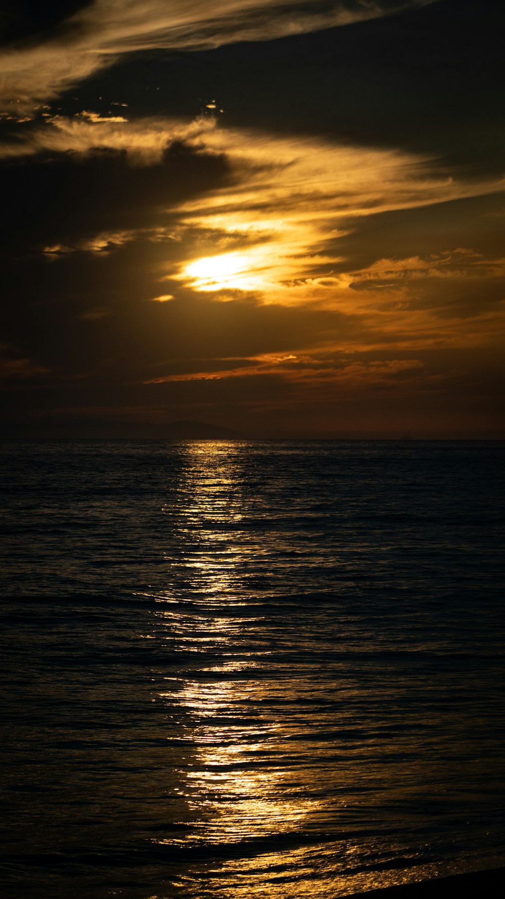 body of water during sunset