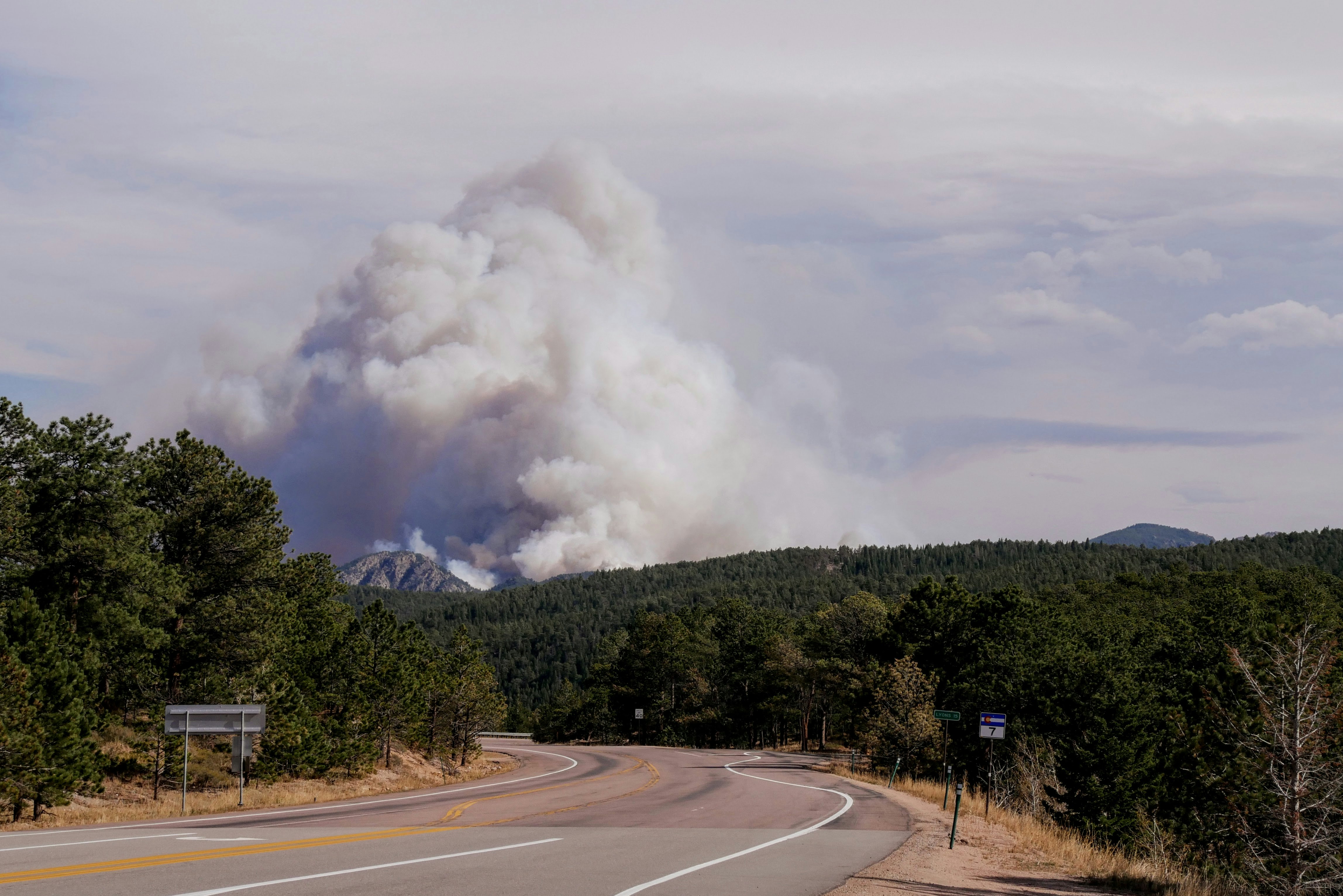Taken on the day the calwood fire started from the peak to peak highway. Showing the smoke plume created from the fire after growing to 8000 acres within the first 5 hours and the empty road. 